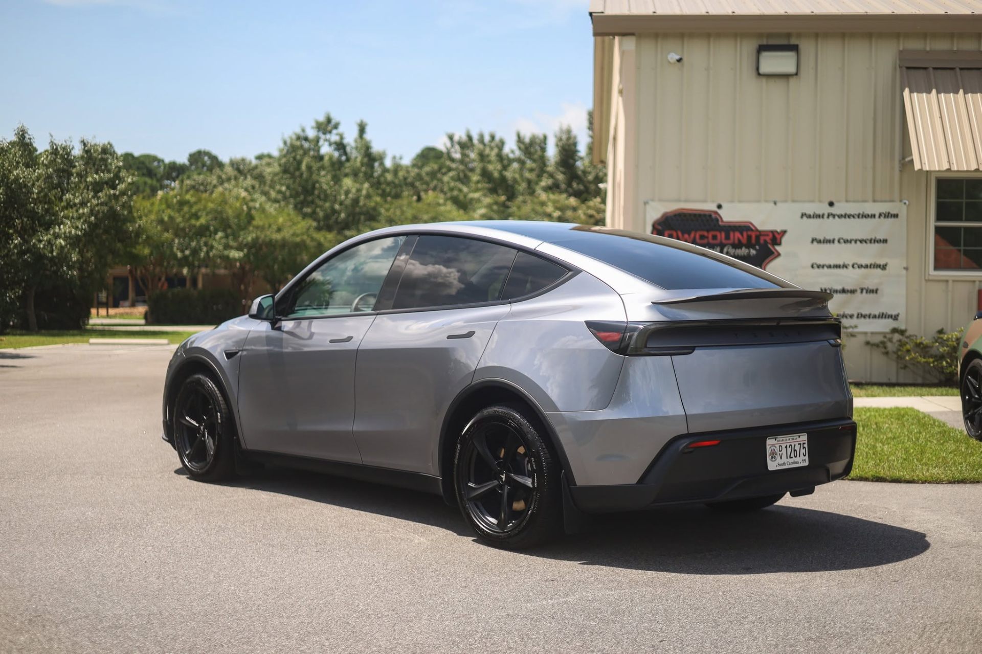 Tesla Model Y with XPEL PRIME XR window tint outside the Lowcountry Detail Center shop in Beaufort, SC